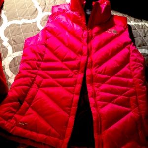 Vibrant red The North Face vest with zipper pockets. Excellent condition. SZ XS.